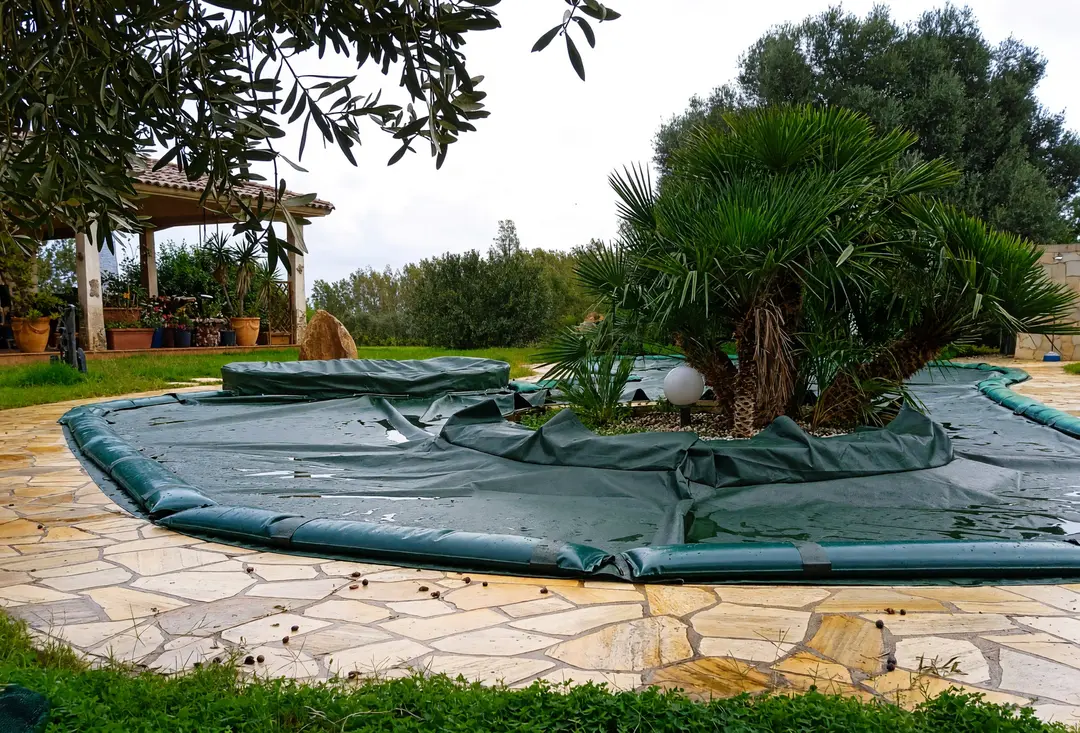 Custom-shaped winter cover on an irregular pool
